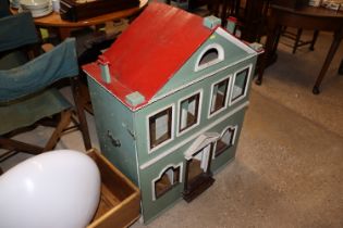 A large vintage painted dolls house fitted side ca