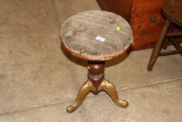 A Victorian walnut and gilt framed revolving music