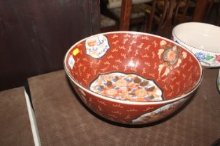 A large Oriental Imari pattern bowl