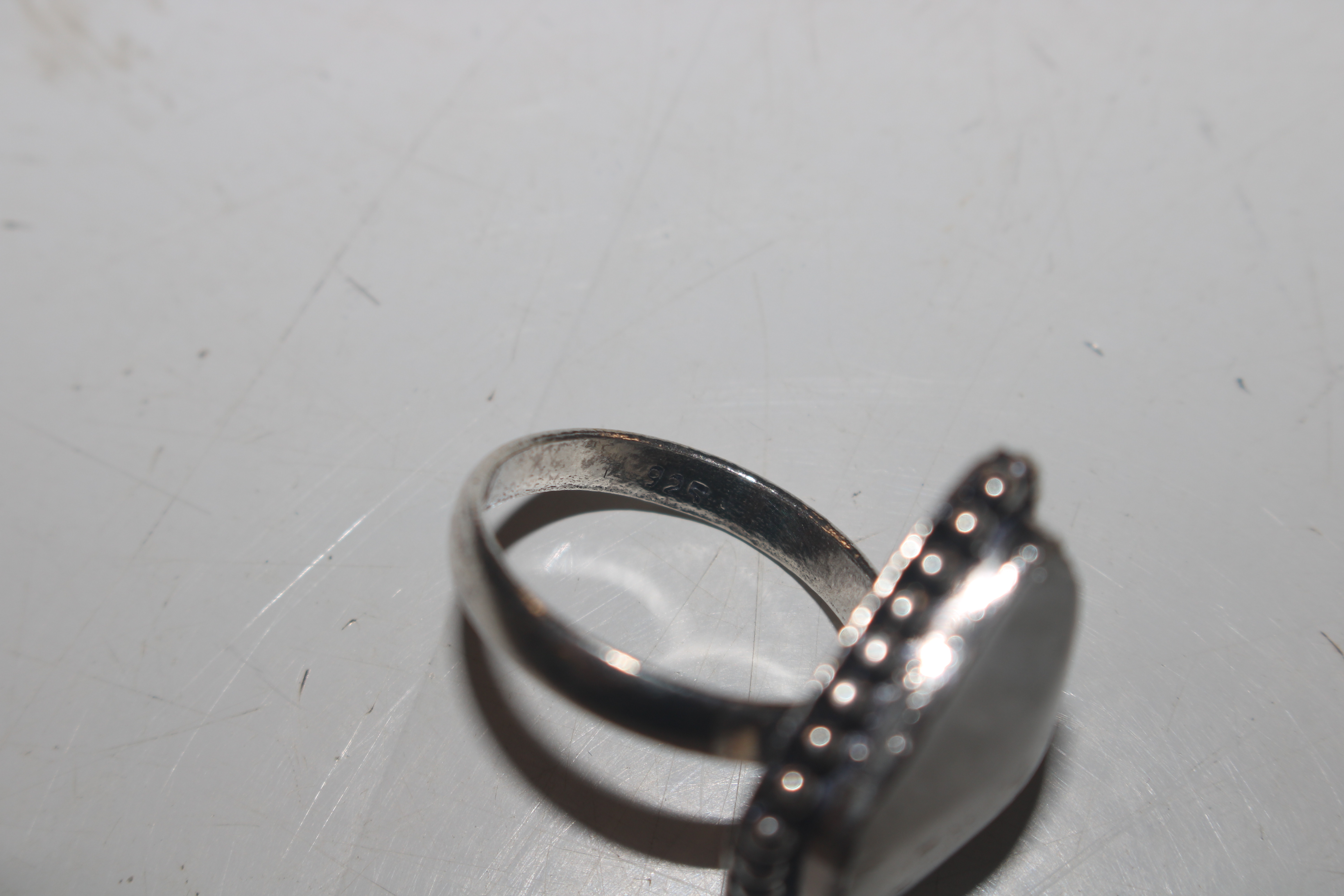 Two white metal bangles; a 925 silver ring with st - Image 3 of 10