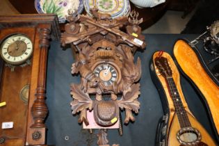 A handmade Black Forest type cuckoo clock, vendor reports from 'The House of 1000 Clocks' in the