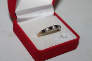 A 9ct gold ring set with blue and white stones, ri