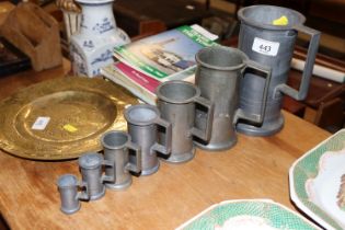 A run of seven antique pewter measures