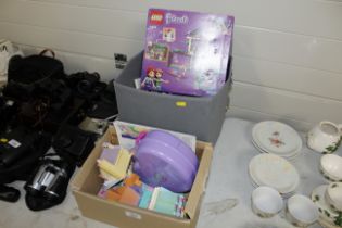 Two boxes containing Lego and Polly Pocket toys