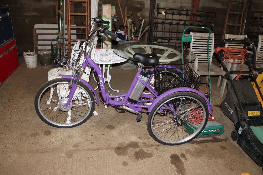 A Jorvik electric tricycle with charger