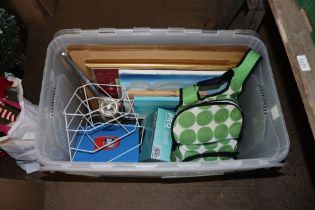 A box containing picnic items, camping equipment, various pictures and prints