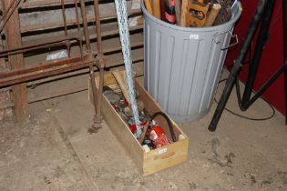 A box containing hand tools and fittings