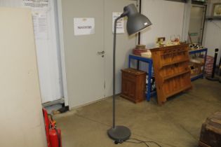 A large grey industrial style standard lamp