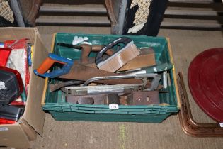 A box of various hand tools and woodworking planes
