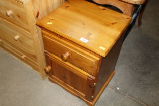 A pine bedside cabinet