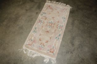 An approx. 4'2" x 2' Chinese rug AF