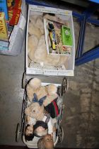 A box containing Teddy bears and dolls