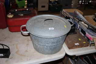 A galvanised twin handled container with lid