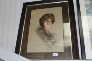 An oak framed portrait print