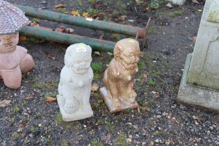 Two concrete garden ornaments in the form of Dogs