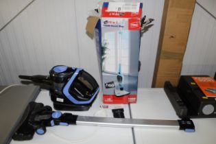 A steam cleaner and hand held vacuum cleaner