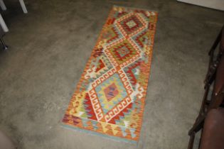 An approx. 6'5" x 2'1" Chobi Kelim rug