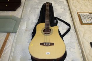 An Ashton acoustic electric bass guitar with carry