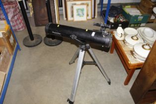 A Celestron Power Seeker telescope on tripod