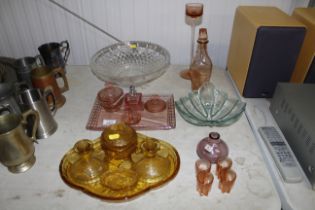 A collection of coloured glass dressing table item