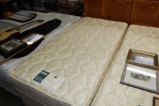 A Carlton single divan bed and mattress with pine