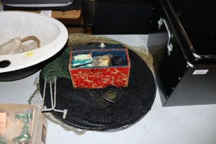 A box of fishing tackle and keep nets