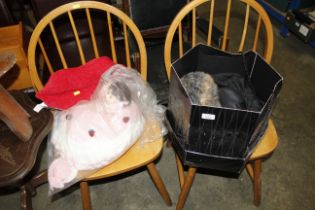 A hat box, various hats, doll, doorstop etc.