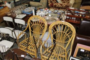 A pair of cane elbow chairs