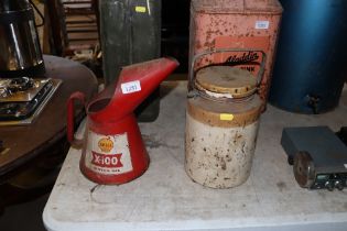 A Shell motor oil can and a stoneware jar