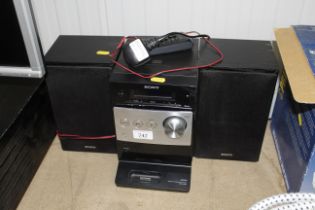 A Sony Hi-Fi with remote control and a pair of speakers