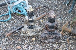 Two concrete garden ornaments in the form of Buddh