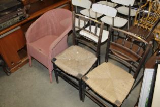 A Lloyd Loom chair and a pair of spindle back rush