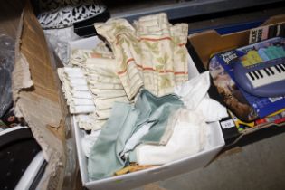 A box of curtains and material