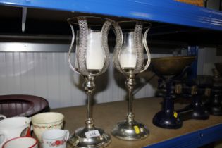 A pair of candle stands