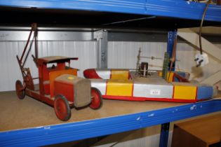 A model catamaran and a tin plate toy truck