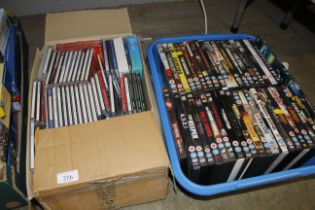 Two boxes containing CDs and DVDs