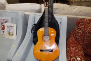 A Hohner acoustic guitar and carrying case