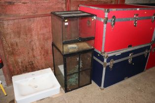 A glass Terra cage and one other