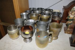 A collection of pewter and other tankards