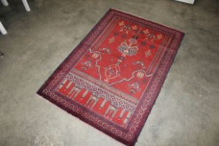 An approx. 4'8" x 3'2" Bolochi rug