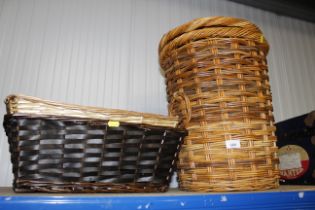 A wicker linen basket and two other baskets