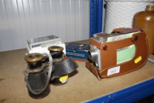 A Kodak Brownie cine camera; a pair of opera glass