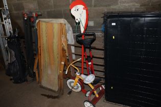 A child's Raleigh tricycle, pogo stick and hobby h