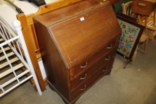 An Edwardian mahogany inlaid bureau fitted three d