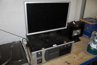 A rack mounted desk top computer and monitor