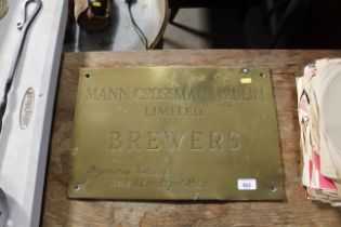 A brass plaque "Mann Crossman & Paulin Ltd Brewers