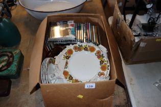 A box containing Grindley "Indian Summer" patterned dinnerware and CDs