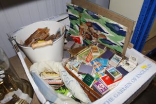 A box containing advertising beer mats and matchbo