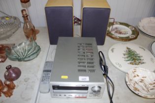 A TEAC CD receiver with remote control and pair of speakers