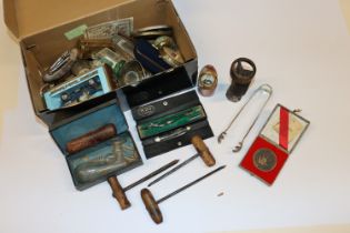 A box of collectable items including boxed, Matchb